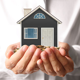 image of a pair of hands holding coins and a tiny model home for the owners section